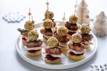 Christmas roast dinner canapes with roast potato, turkey, stuffing and sausage