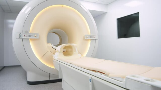 Medical CT, MRI or PET in a modern hospital laboratory. Technologically advanced and functional medical equipment in a clean white room.