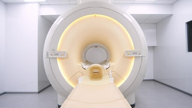 MRI scanner room. Turning on the magnetic resonance imaging machine. Modern medical center and medical technologies. The lights in the medical department turn on.