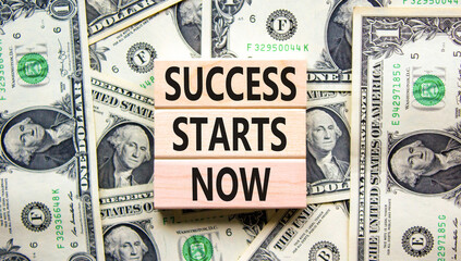 Success starts now symbol. Concept word Success starts now on beautiful wooden block. Dollar bills. Beautiful dollar bills background. Business motivational success starts now concept. Copy space.