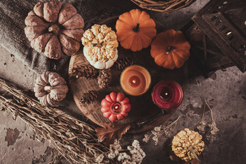 Home decoration with pumpkins and candles for Thanksgiving and Halloween