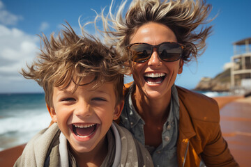 Close-up portrait of a beautiful woman and her son on board a pleasure boat. Cheerful, smiling mother and boy are traveling, enjoying their time. Recreation, travel and entertainment.