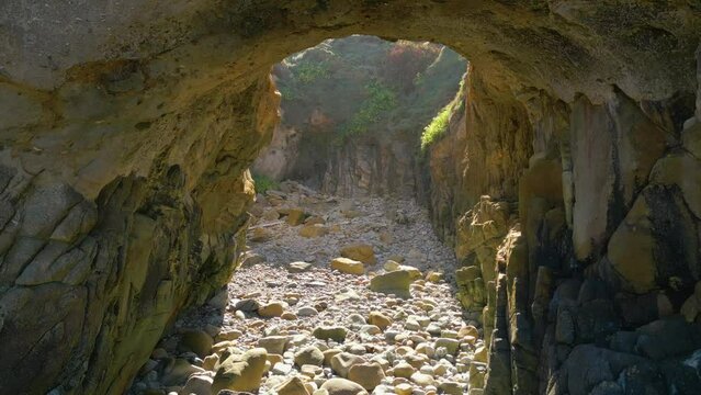 Flying Through The Entrance Of Furna de Caion (Cave Of Caion) In Spain. - aerial