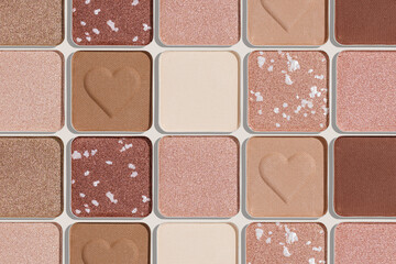 Eye shadows beige color swatches, creative cosmetic texture background, different shiny and matte eyeshadow, trend geometric pattern, aesthetic beauty template, neutral color powder for makeup