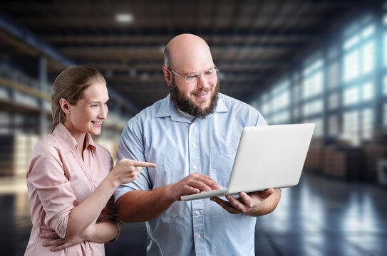 Two business people at work in warehouse, AI generated image