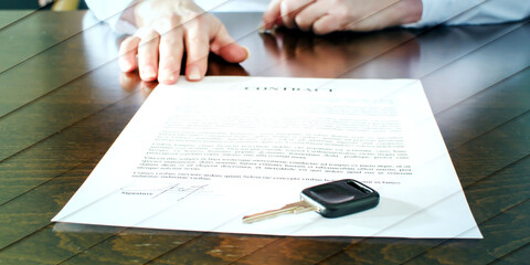 Female car buyer sitting in front of contract, geometric pattern