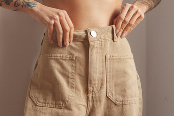 Woman waist on jeans close up - obrazy, fototapety, plakaty