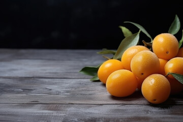 Kumquat fruit on the wooden table close up