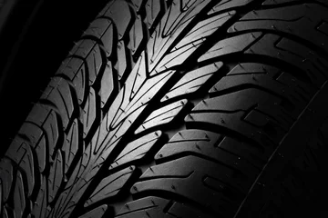 Foto op Canvas Black car tire surface texture pattern, close up © nnattalli