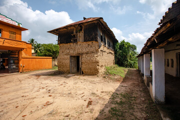 Tribal mural on wall of a mud house in a tribal village in Birbhum, West Bengal