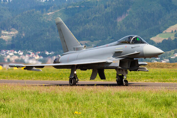 Military fighter jet plane at air base. Airport and airfield. Air force flight operation. Aviation...