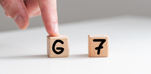 Human hand put wooden block and set technology word G7. Network future. High speed of mobile...