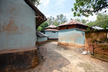 Fototapeta na wymiar Tribal mural on wall of a mud house in a tribal village in Birbhum, West Bengal