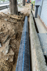 Construction site with new Water Pipes in the ground. sewer pipes to repair or restore in street city