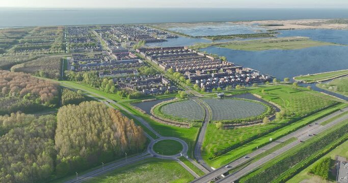 Modern sustainable neighborhood in Almere, Netherlands, with a focus on district heating and a solar panel island.