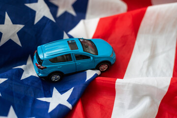 Reflection of American flag in the headlight of a classic car on route 66 america's iconic highway