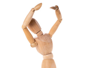 A wooden mannequin holding his arms up. Perfect for illustrating concepts of success, achievement,...