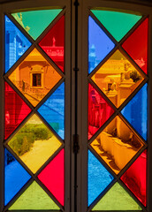 Antique multi-colored stained glass windows. - 664553446