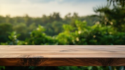 Empty wood table with blur green nature In the forest background.