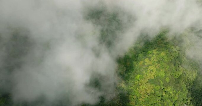 Clouds over the mountain with rainforest in Camiguin Island. Philippines.