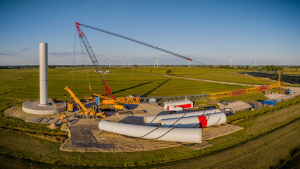 Panoramic view of the construction site of a modern wind turbine in the start-up phase in the...