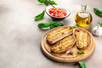 Toasted bread with garlic and extra virgin olive oil. Food recipe background. Close up