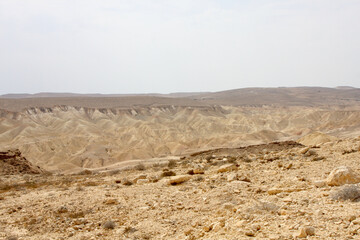 Open Negev Desert in South Israel. Sand dunes with dry air on a summer day.