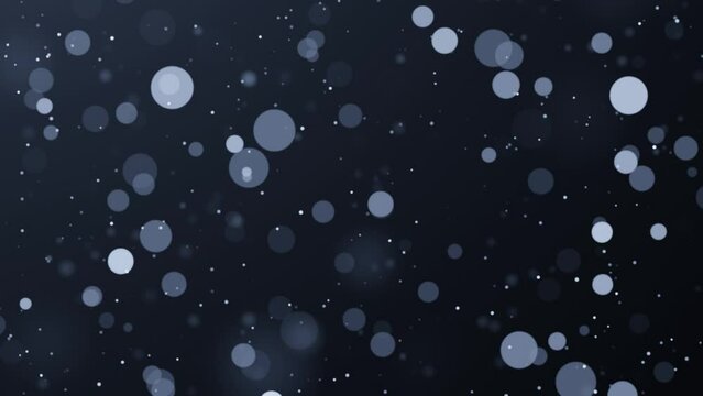 Blue particles on dark background. Bokeh glitter dust seamless loop animation.