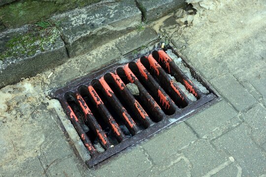 Someone without imagination spilled orange paint down the sewer