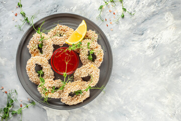 fried squid rings on a light background top view. place for text