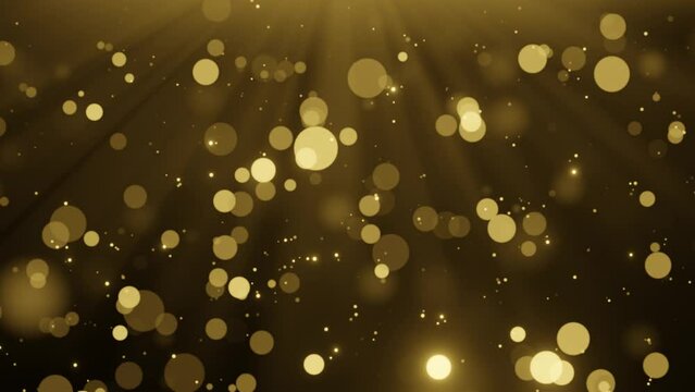 Golden particles falling on dark background. Bokeh glitter dust seamless loop animation.