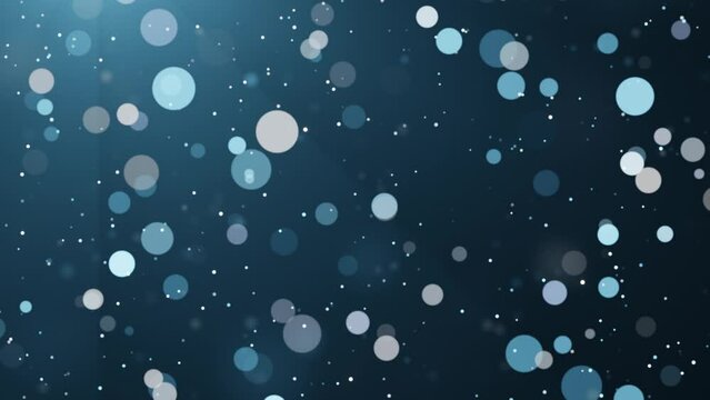 Blue shimmering particles on dark background. Bokeh glitter dust seamless loop animation.