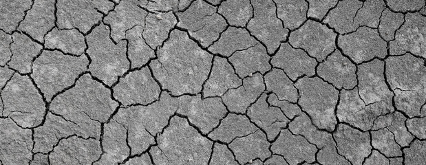Wall texture soil dry crack pattern of drought lack of water of nature brown old broken background.