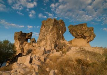 Fototapeta na wymiar Historical Forty Stairs Rock and Phrygian rock chambers by Lake Emre. Phrygian valley. Travel destinations in Turkey. Ihsaniye district, Afyonkarahisar