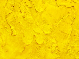 Elegant gold background, thick yellow texture painted in marbled messy grunge design with blobs and brush strokes, fancy rich golden color wall backdrop with no people