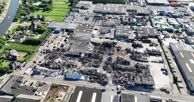 Aerial drone view of the aftermath of a large fire in Ter Aar on an industrial complex.