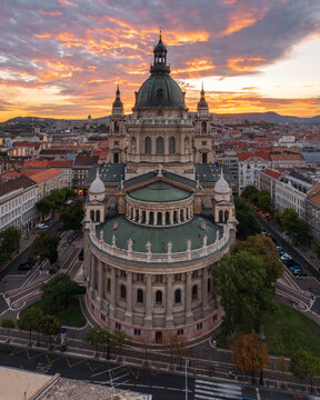 Aerial skyline view about the famous St. Stepehen's Basilica in the downtown of Budapest. Aerial cityscape. Spectacular sunset over Buda hills.