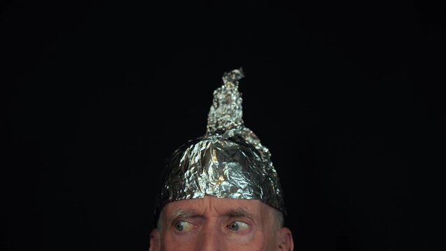 A conspiracy theory believer wearing a tinfoil hat