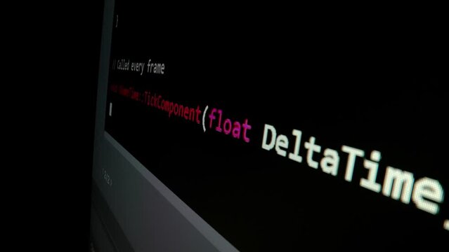 Closeup macro shot movement of coding script moving across LED screen with real-time AI-generated typing, showcasing advanced AI learning in optimization, debug and coding for software development.