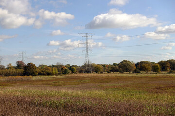 Rural Autumn Landscape with High Voltage Transmission Tower