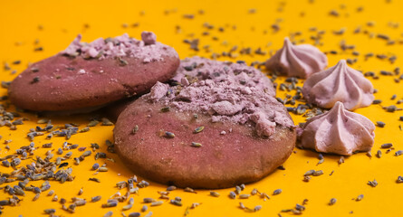 Lavender cookies and little marshmallows with lavender flowers on the edges. Close-up	
