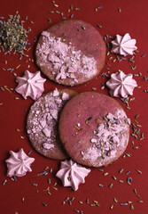 Lavender cookies and little marshmallows with lavender flowers on the edges. Close-up	