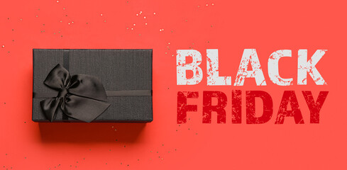 Gift box and text BLACK FRIDAY on red background