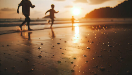 Fototapeta premium Children playing joyfully on the beach at sunset.