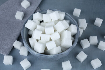 Sugar cubes in blue bowl