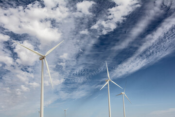 Wind turbines with blue sky background with clouds
