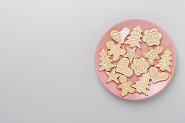 Obraz na płótnie Canvas Cute homemade Christmas cookies on color background,top view