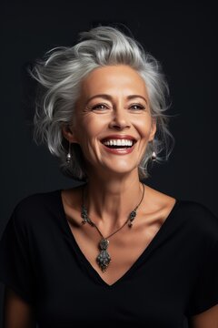 middle age woman with grey hair smile in studio, 50s 60s senior  female laughing, skincare and beauty concept