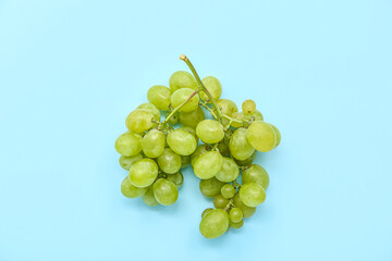 Sweet green grapes on blue background