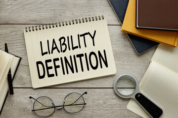 LIABILITY DEFINITION paper with text near clear stickers